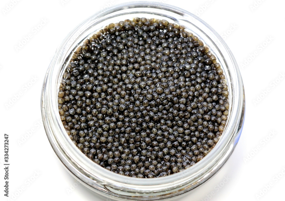 Black sturgeon caviar on a white background. Black sturgeon caviar on a white background.
