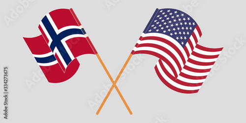 Crossed and waving flags of Norway and the USA
