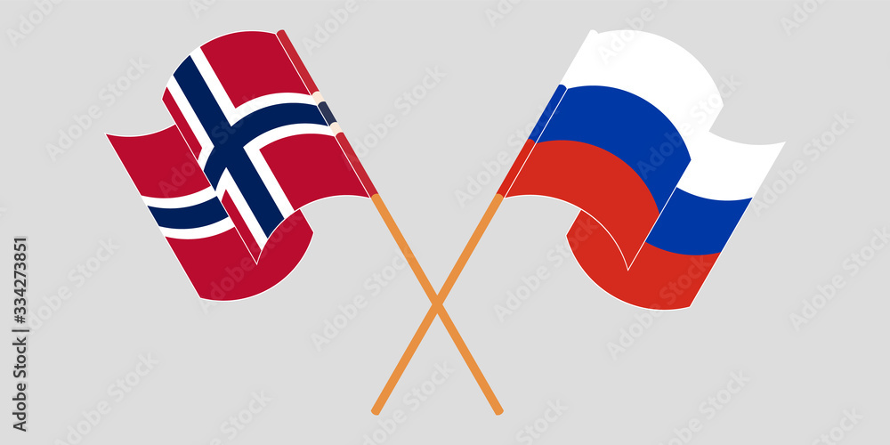 Crossed and waving flags of Norway and Russia