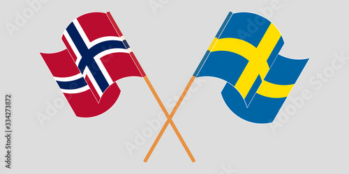 Crossed and waving flags of Norway and Sweden