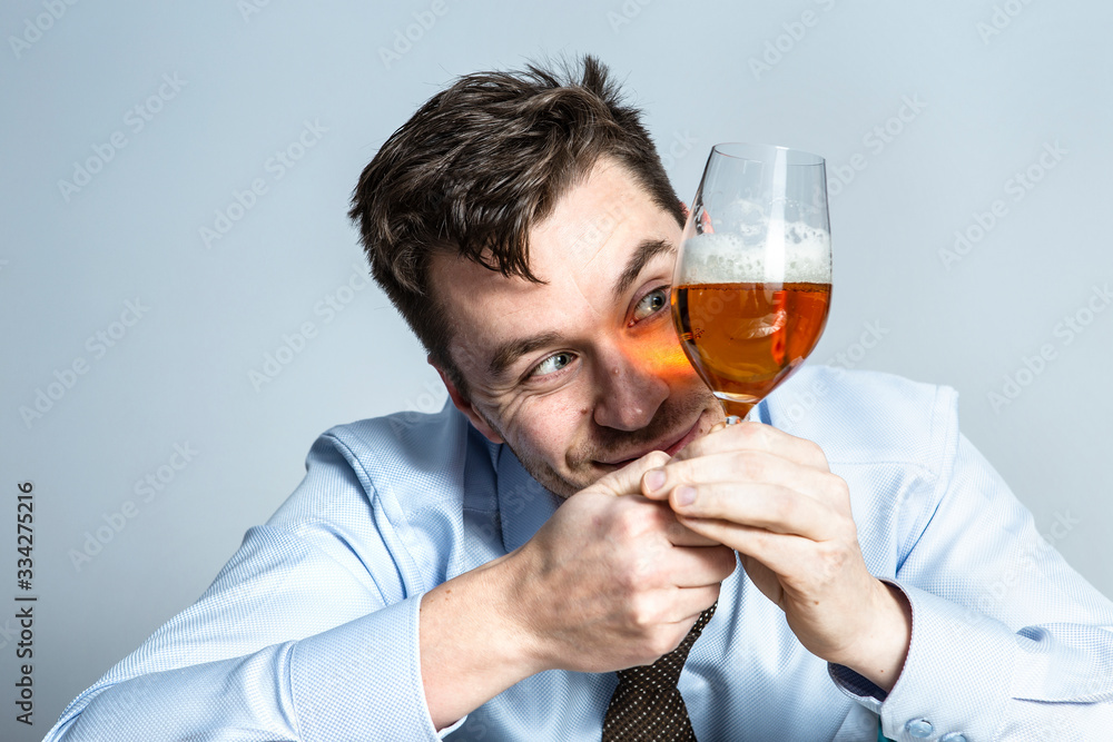 quarantine, self-isolation, coronavirus epidemic. A young man in a business shirt does not leave home due to a pandemic quarantine, self-isolation, coronavirus epidemic. A young man in a business shirt does not leave home due to a pandemic