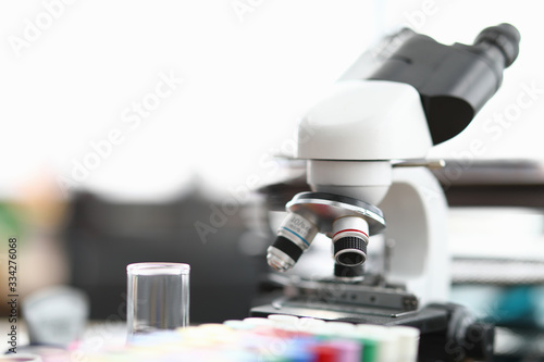 Chemical laboratory there is microscope and tubes. Incubation period infectious diseases. Empty test tubes for blood test in laboratory. Virus test in laboratory. Healthcare in world