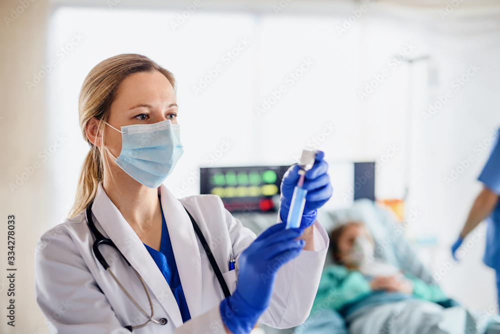 Doctor with syringe in quarantine in hospital, coronavirus concept. Doctor with syringe in quarantine in hospital, coronavirus concept.