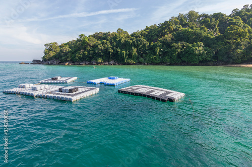 Empty swim platform floating on a lake photo