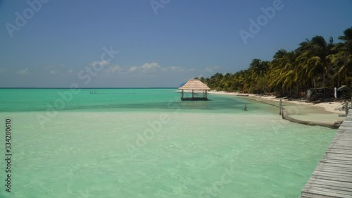 Onok Island Balabac, Philippines. The island of white sand on a large atoll. Tropical island with palm trees. Seascape with a paradise island.