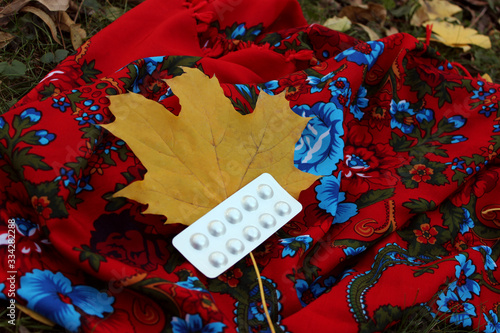 autumn mood, scarf and pills