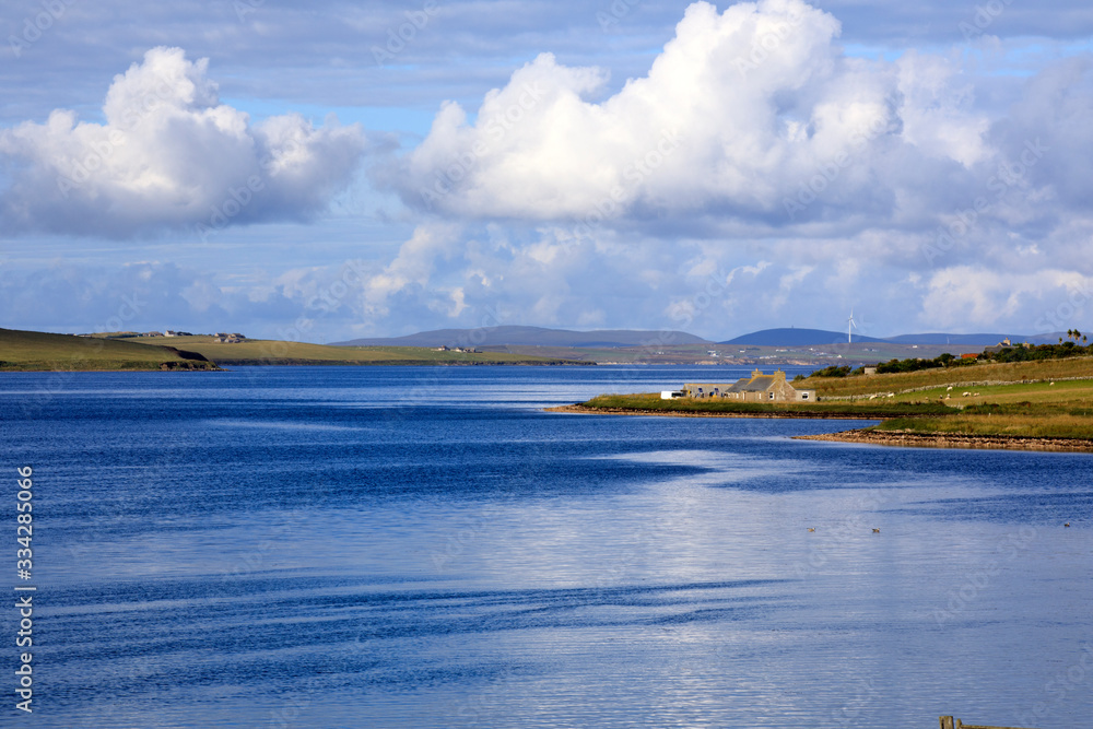 Scapa Flow - Orkney (Scotland), UK - August 07, 2018: Landscape near harbour of Scapa Flow, Orkney, Scotland, Highlands, United Kingdom Scapa Flow - Orkney (Scotland), UK - August 07, 2018: Landscape near harbour of Scapa Flow, Orkney, Scotland, Highlands, United Kingdom
