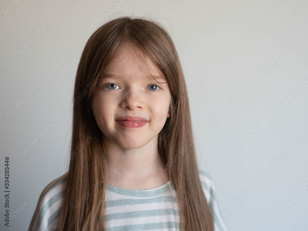 Portrait of a cute little smiling girl on a white background Portrait of a cute little smiling girl on a white background
