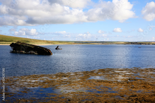 Scapa Flow - Orkney (Scotland), UK - August 08, 2018: World War II boat intentionally sunk to protect the natural harbour of Scapa Flow, Orkney, Scotland, Highlands, United Kingdom photo