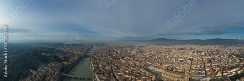 Aerial panorama of Florence at sunrise, Firenze, Tuscany, Italy, cathedral, river, drone pint view, mountains is on background