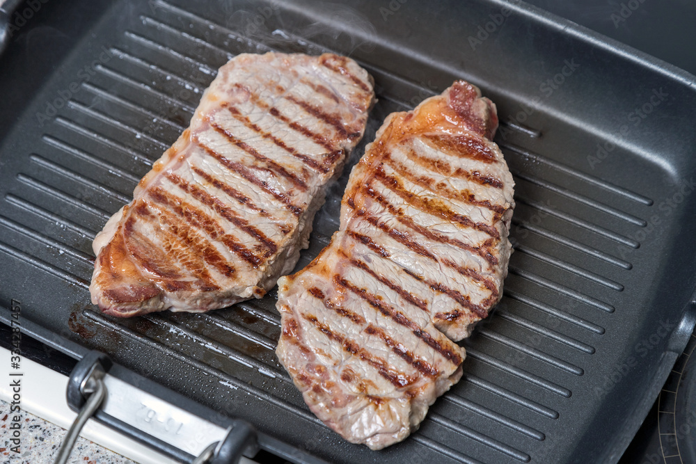 pan-fried beef steak. brown crust on the meat. pan-fried beef steak. brown crust on the meat.