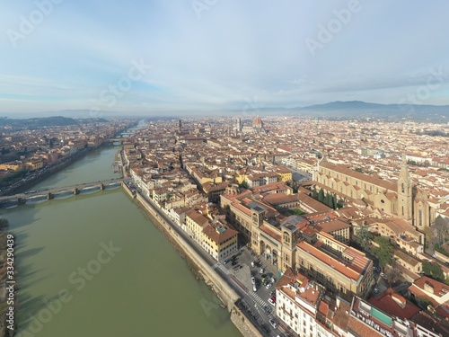 Aerial panorama of Florence at sunrise, Firenze, Tuscany, Italy, cathedral, river, drone pint view, mountains is on background © Vladimir Drozdin