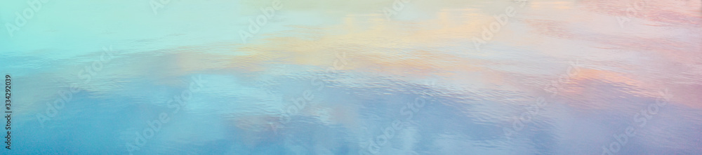 Obraz premium Watercolor background with peach, pink, purple, and blue tones.