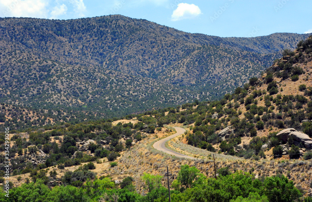 Curving Road Leads into the Sandia Mountains