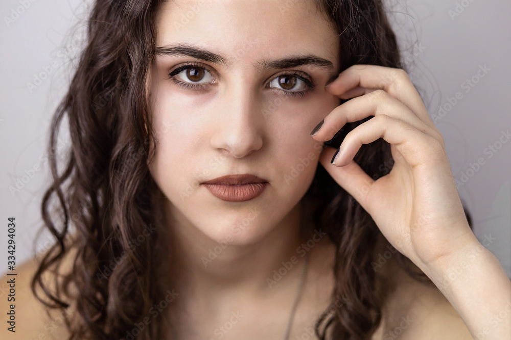 Close-up portrait of beautiful brunette teen girl with white background. Close-up portrait of beautiful brunette teen girl with white background.
