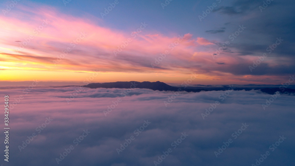 Above the clouds at sunset Above the clouds at sunset