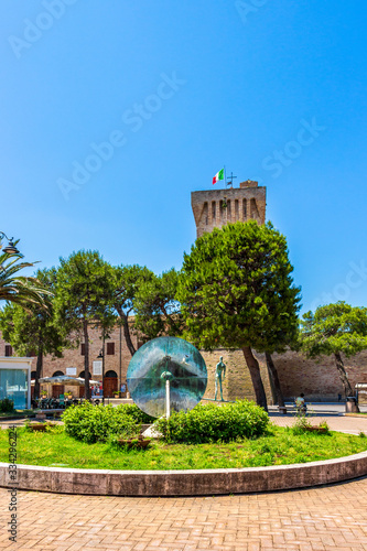 Piazza Brancondi or Brancondi Square with the bronze sculpture by Cecco Bonanotte, Castello Svevo in the background. In Porto Recanati, Province of Macerata, Marche, Italy