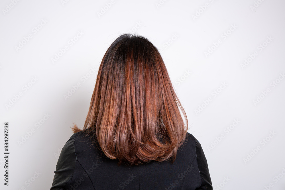 Close up of smooth red-haired woman shot from behind isolated on wite background Close up of smooth red-haired woman shot from behind isolated on wite background