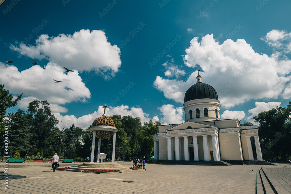 Oldest Orthodox church in Chisinau, Moldova on a sunny day, viewed from the front plateau of the cathedral. Sunny warm summer day in Moldova.