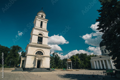 Belltower of the oldest Orthodox church in Chisinau, Moldova on a sunny day, viewed from the main plateau of cathedral. Sunny warm summer day in Moldova. © Anze
