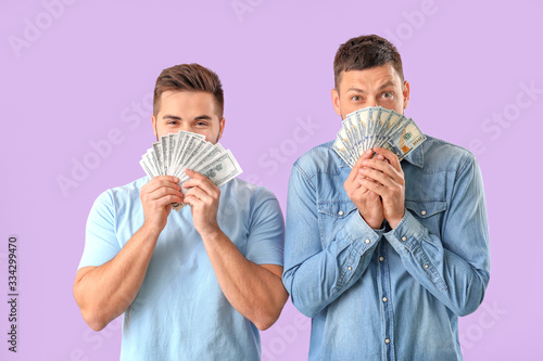 Emotional men with money on...