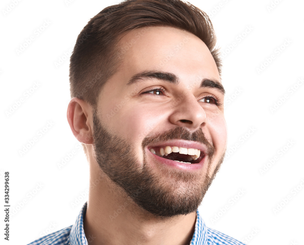 Obraz premium Handsome smiling young man on white background
