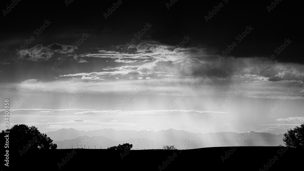 Fototapeta premium Dramatic summer Storm Clouds gather over the front range of the Rocky Mountains (Black and White)