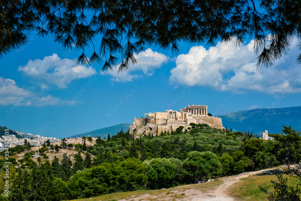 Famous greek tourist landmark - the iconic Parthenon Temple at the Acropolis of Athens as seen from Philopappos Hill, Athens, Greece