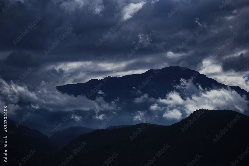 Pikes Peak High Altitude Enormous Mountain Peak in Clouds