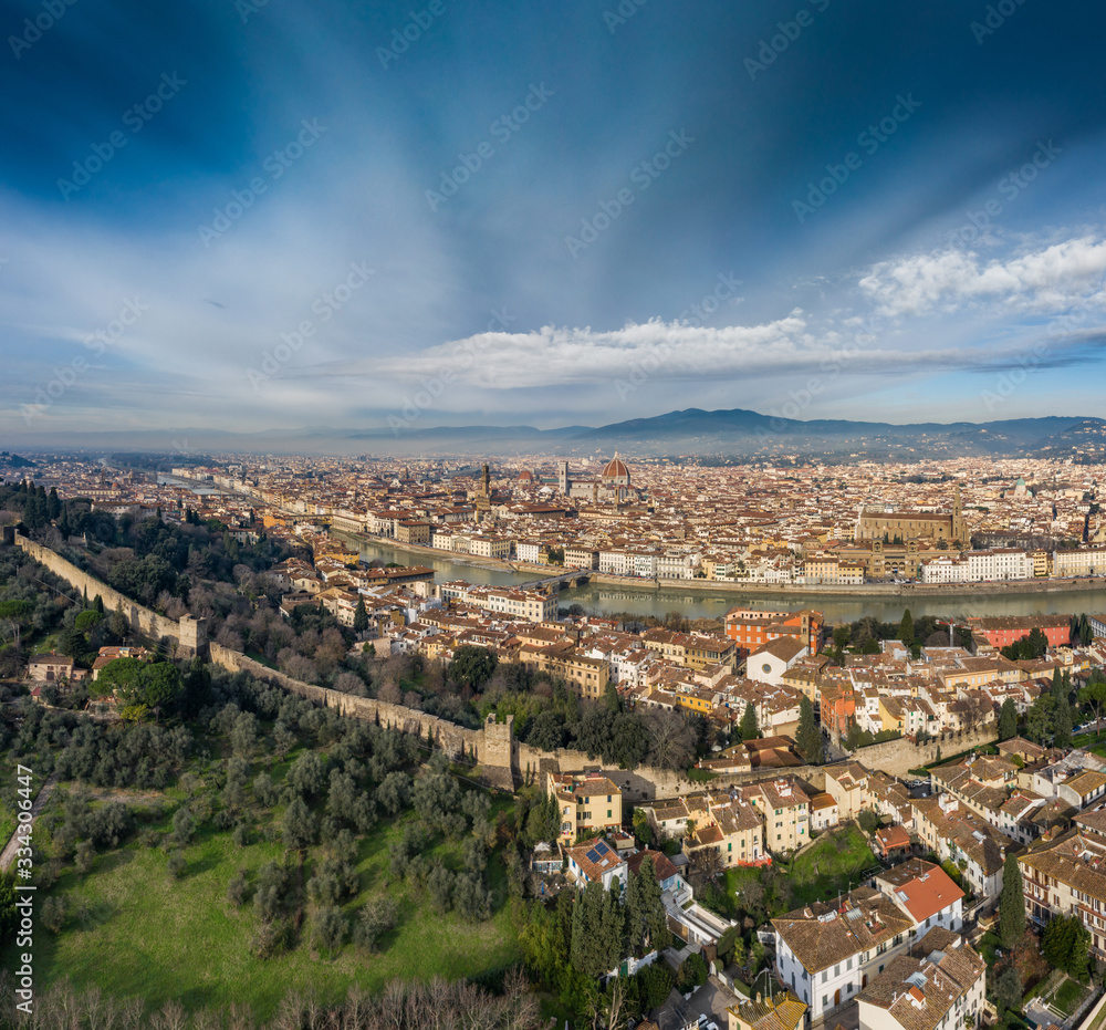 Obraz premium Aerial panorama of Florence at sunrise, Firenze, Tuscany, Italy, cathedral, river, drone pint view, mountains is on background