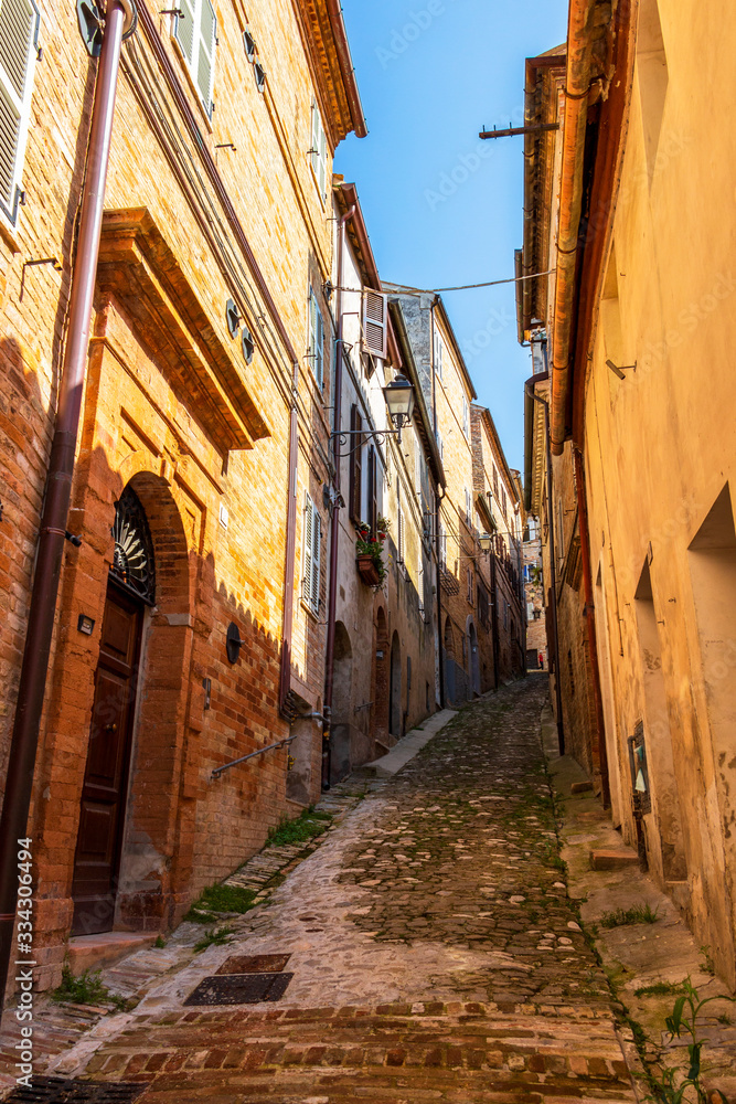 View of a beautiful narrow steep street in Fermo, Province of Fermo, Marche Region, Italy