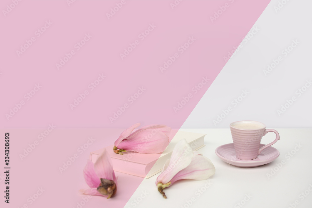 cup of cappuccino on a white table, blooming magnolia buds, a book in a white cover on a delicate pink background, a blank for the designer, an invitation form, a spring mood concept cup of cappuccino on a white table, blooming magnolia buds, a book in a white cover on a delicate pink background, a blank for the designer, an invitation form, a spring mood concept