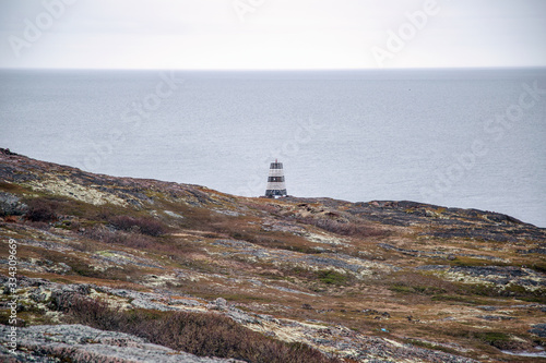 lighthouse on coast of sea photo