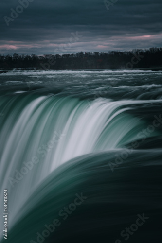 Evening closeup photograph of the Canadian Niagara Falls.