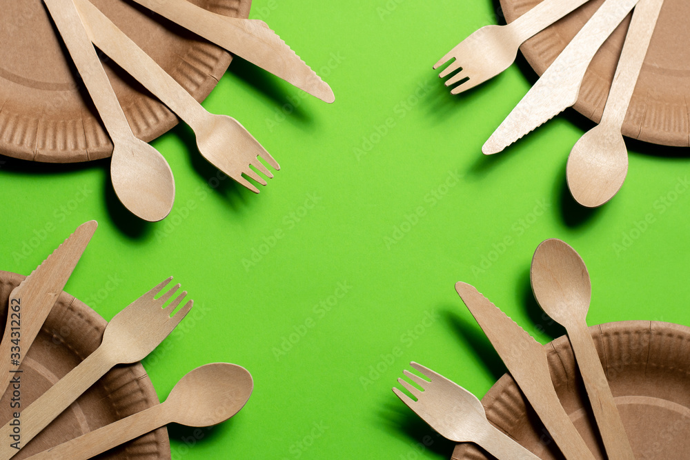 in the four corners of the sets on a paper plate are a knife, fork and