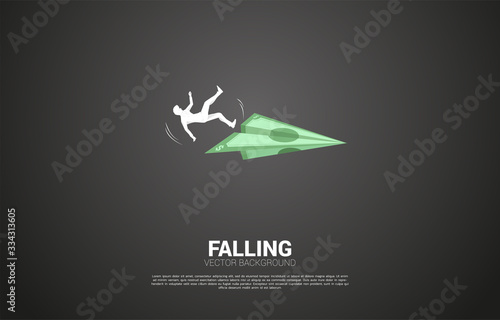 silhouette of businessman slip and falling down from money banknote origami paper airplane. Concept for fail and accidental business