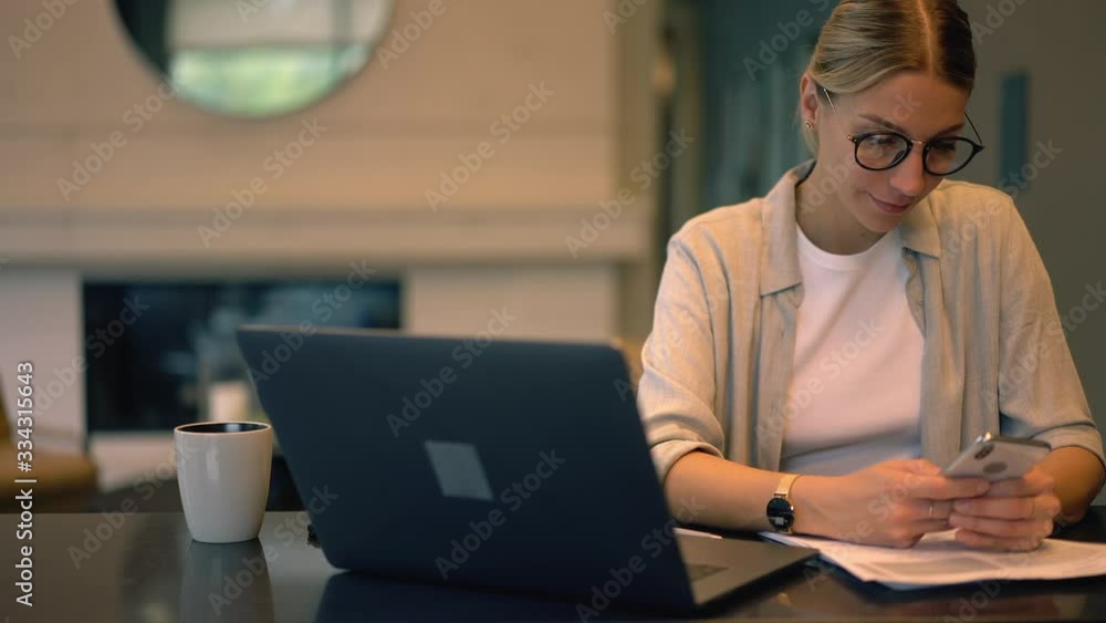 Female book editor in optical spectacles for vision protection using mobile device for online networking during free time, attractive female student messaging on cellphone during time for e learning Female book editor in optical spectacles for vision protection using mobile device for online networking during free time, attractive female student messaging on cellphone during time for e learning