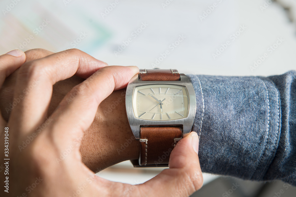Fototapeta premium businessman looking at his watch on his hand