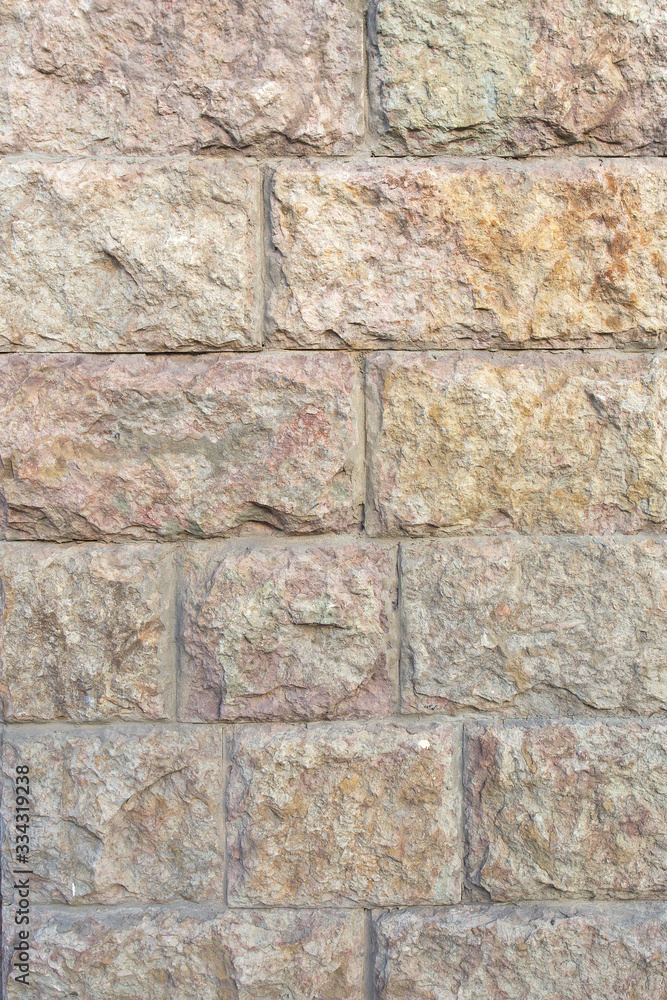 Naklejka premium wall of large textured concrete blocks