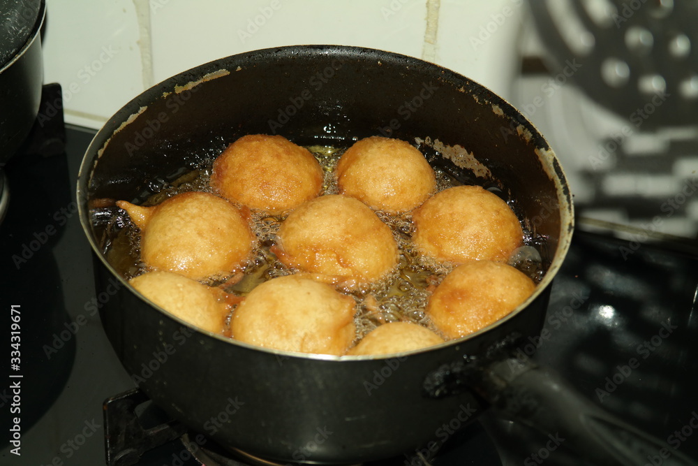 rain cookie - bolinho de chuva fried dough in the shape of balls, tipica do Brasil recipe with cinnamon and sugar rain cookie - bolinho de chuva fried dough in the shape of balls, tipica do Brasil recipe with cinnamon and sugar