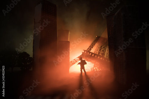 Photography Empty street of burnt up city, flames on the ground and blasts with smoke in the distance