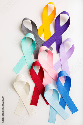 Multi colored cancer ribbons Proudly worn by patients, supporters and survivors for world cancer day. Bringing awareness to all types of cancer photo