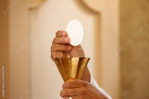 Consecration of bread and wafer wine photo