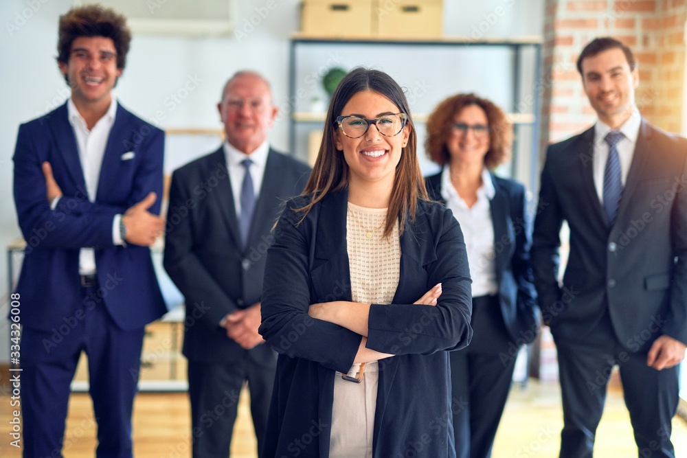 Group of business workers smiling happy and confident in a meeting. Standing with smile on face looking at camera at the office. Group of business workers smiling happy and confident in a meeting. Standing with smile on face looking at camera at the office.