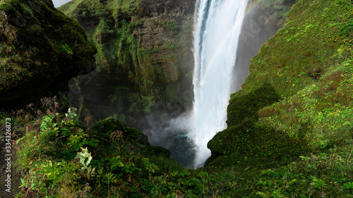 Skogafoss waterfall in flourishing season - Top View