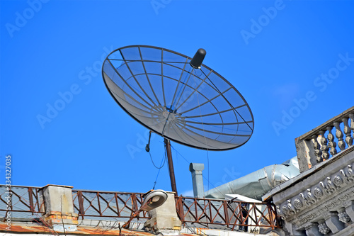 satellite antenna with converter on the building rooftop, modern telecommunication diversity