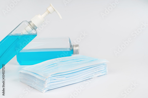 Medical surgical mask and sanitizer hand gel bottle for hand hygiene covid-19 virus protection isolated on white background. Concept of health care products.corona virus prevention.
