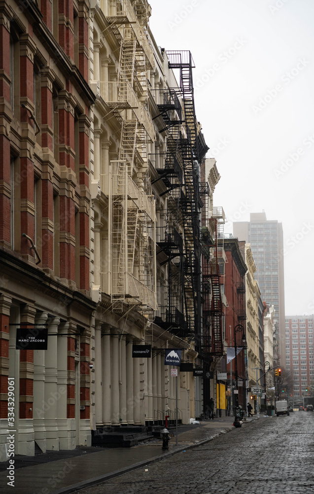 Empty New York City streets without people and closed shops during pandemic coronavirus outbreak in America. 