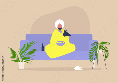 Stay home concept, social self isolation, young indian character cuddling with their dog wrapped in a blanket