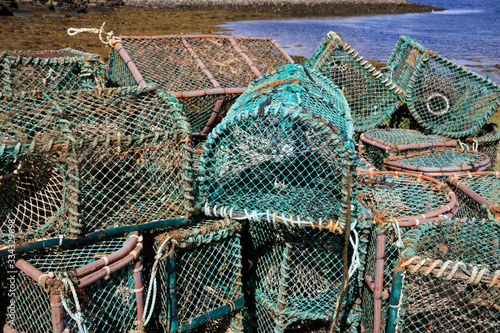Orkney (Scotland), UK - August 10, 2018: Lobster and crab fishing pots piled in the port, Orkney, Scotland, Highlands, United Kingdom